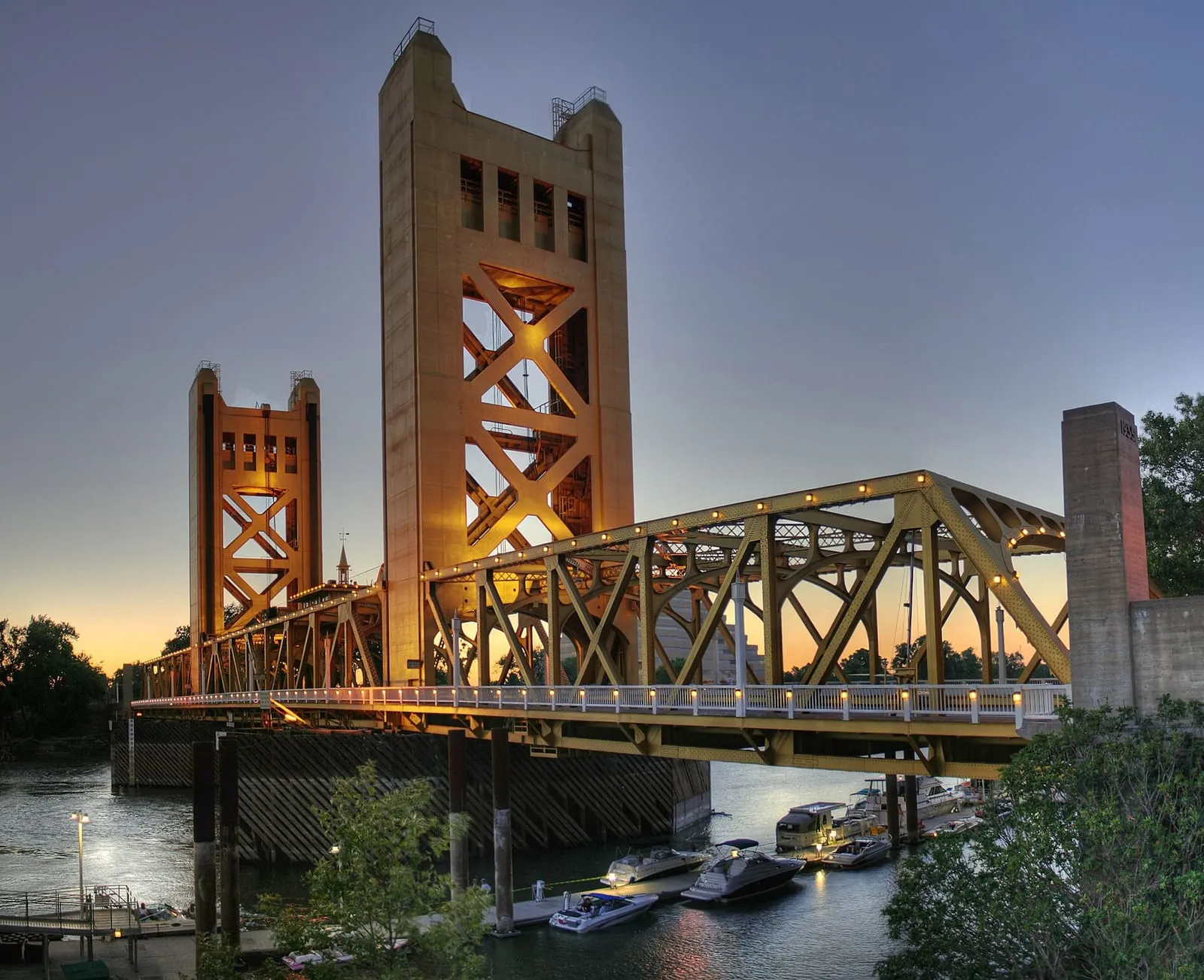 The Sacramento Valley at dawn — the Sierra foothills and the Tower Bridge over the river.